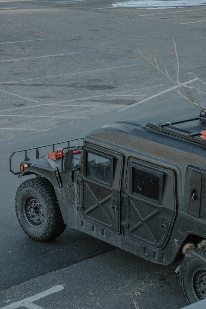 a hummer parked in a parking lot