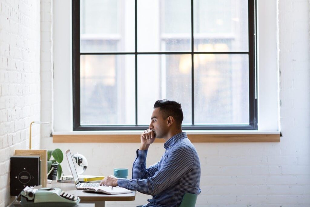 Man sitting behind a computer.