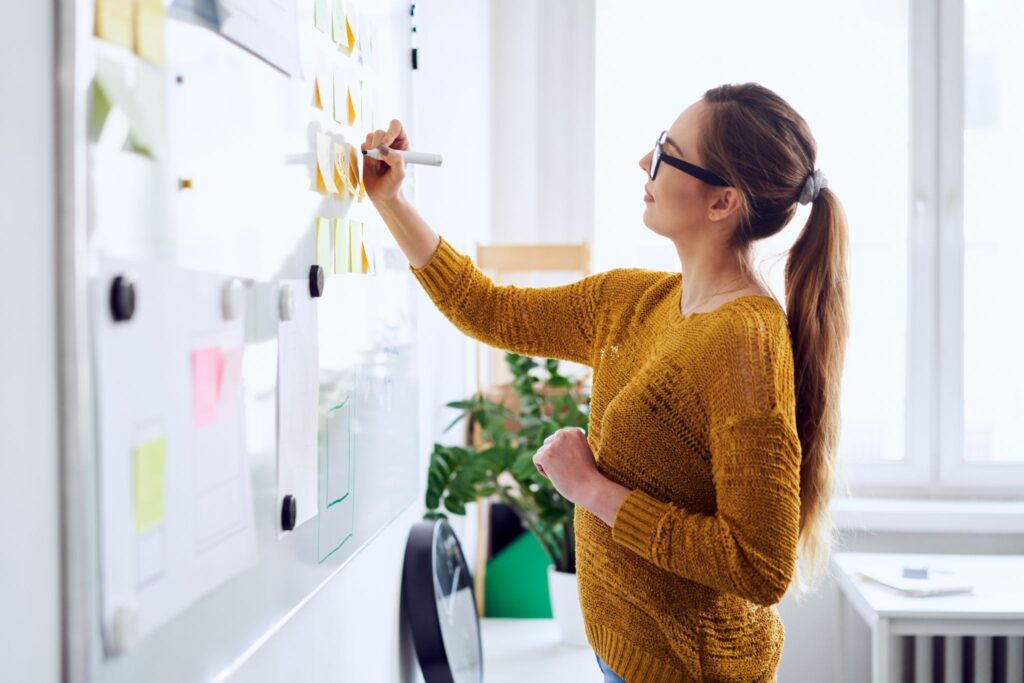image - Lead Grow Develop - Business, Technology, Personal Development woman planning on strategy board