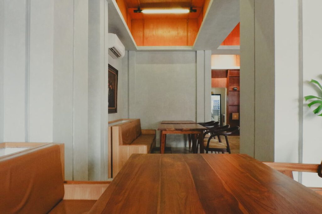 A cozy, minimalist cafe interior in Jawa Barat, Indonesia, showcasing modern aesthetics