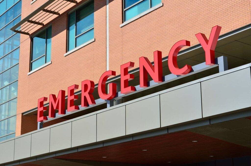 pexels-pixabay-263402 1 - Lead Grow Develop - Business, Technology, Personal Development Close-up of a modern hospital emergency room entrance with prominent red letters