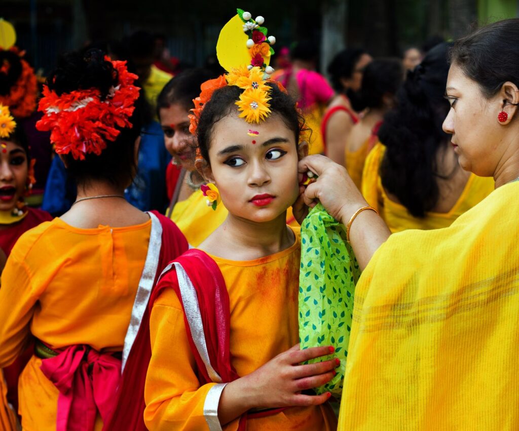 Vibrant traditional festival with girls in colorful attire, showcasing cultural heritage