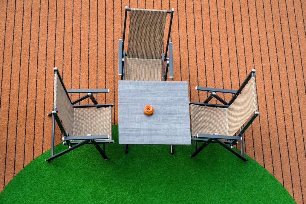 How Artificial Grass Tiles Can Transform Patios, Balconies, and Rooftops 1 balconies and patios
https://www.pexels.com/photo/a-table-and-three-chairs-19436811/