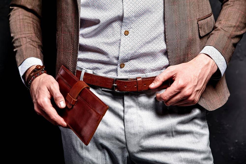 man wearing leather belt